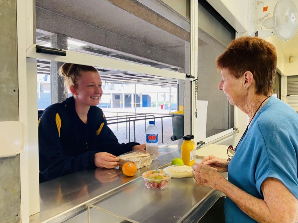 Brisbane Water Secondary College canteen supervisor Michele Parker and student Charli Grant.