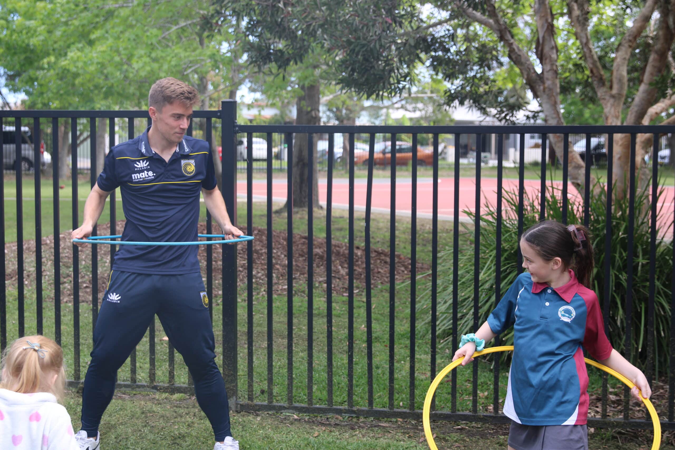 Central Coast Mariners midfielder Max Balard demonstrates some skills with the kids.