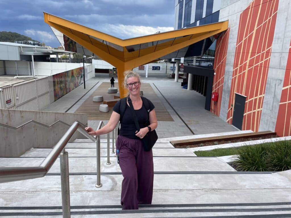 Sally Freeman walking up steps outside one of the buildings located at Gosford Hospital.