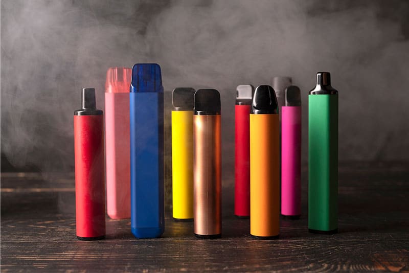 A collection of vapes in various colours.