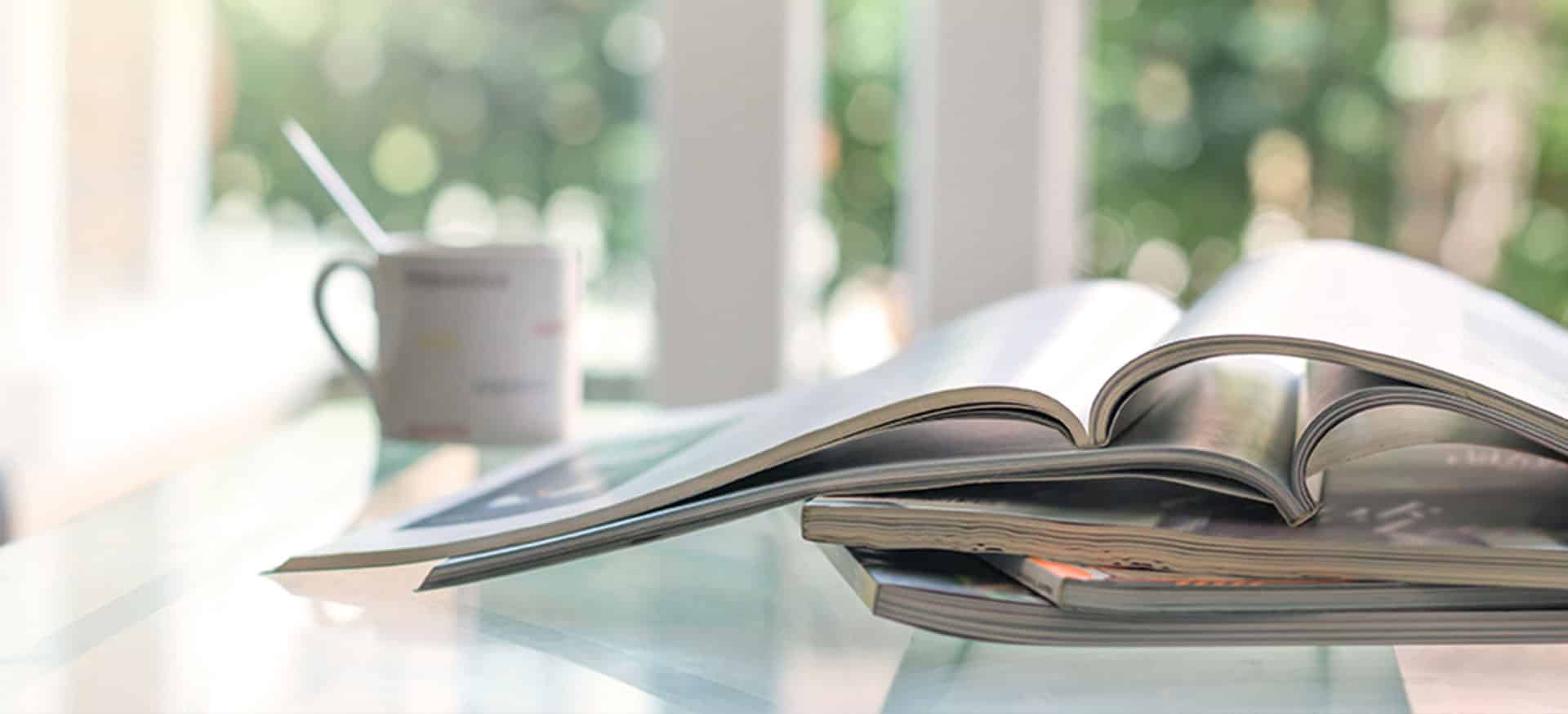 A few magazines or publications sat on a coffee table.