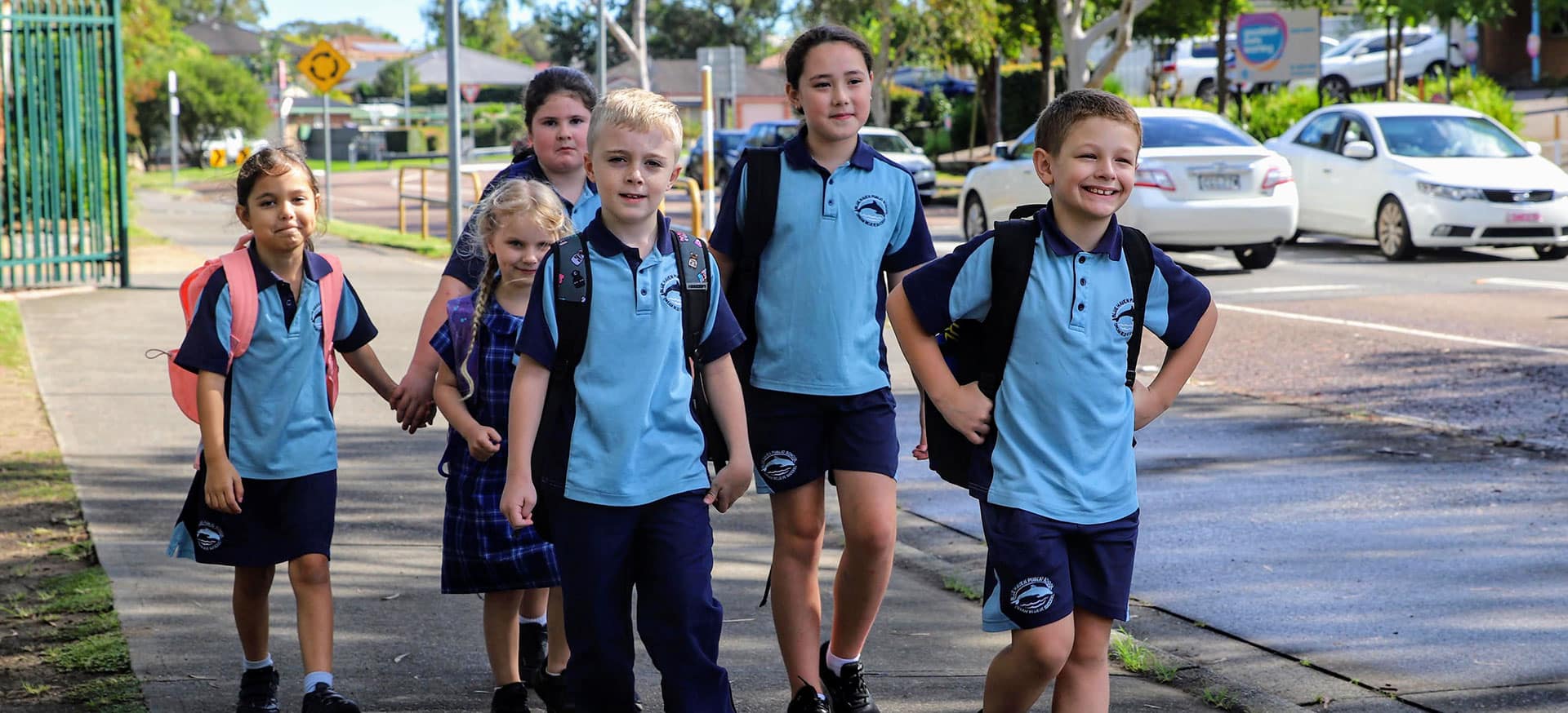 Six children from Blue Haven Public School waking to school.