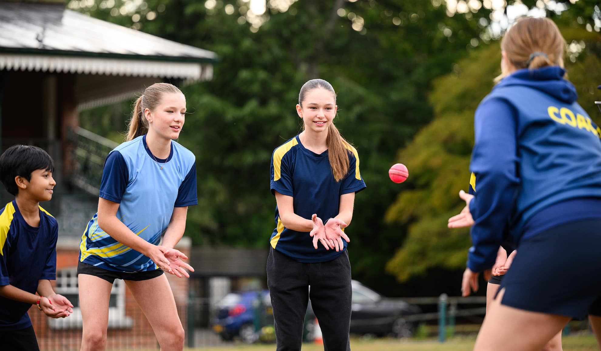 girls cricket teams practicing at club