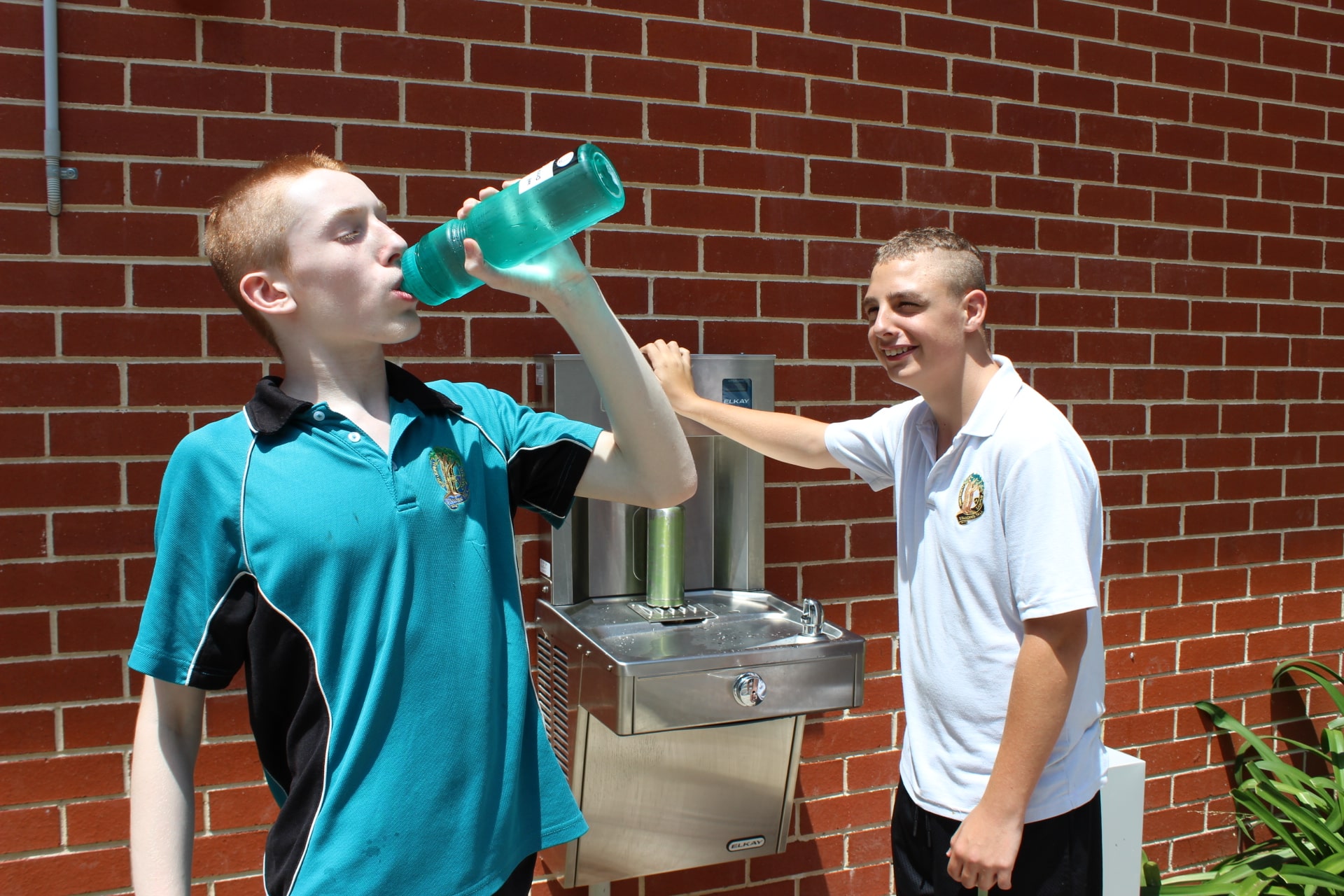 Students form Tumbi HS drinking water near chilled water station