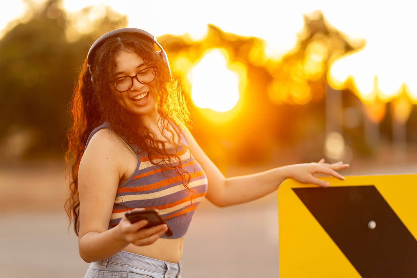 HHS - teenager at sunset_listening to music