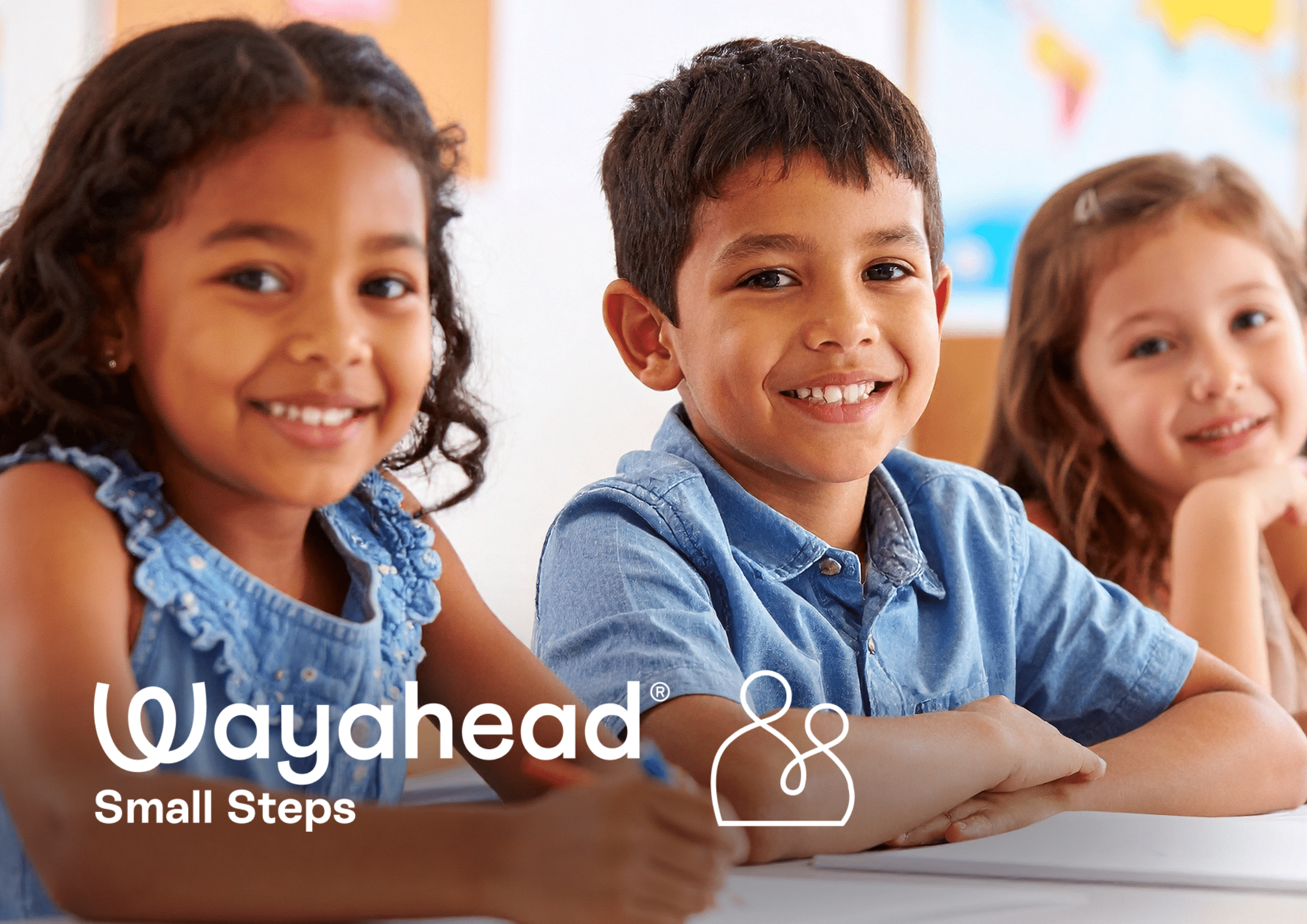 Pre school children sitting at a desk